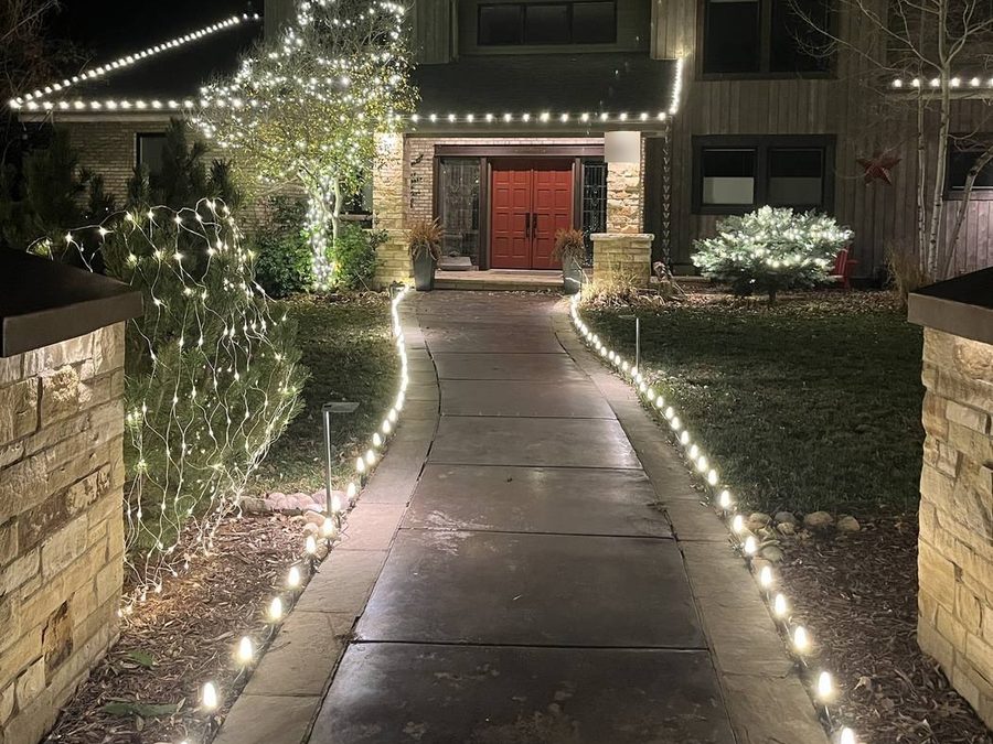 Stake lights lining both sides of a front walkway